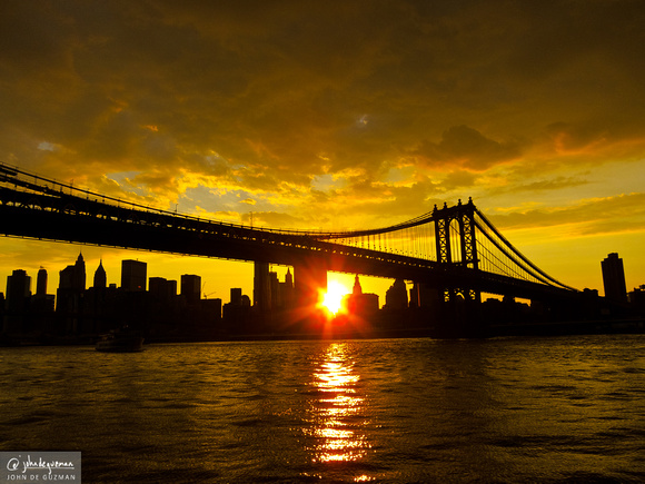 Yellow sunset on the East River, Manhattan Bridge front and center.