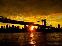 Yellow sunset on the East River, Manhattan Bridge front and center.